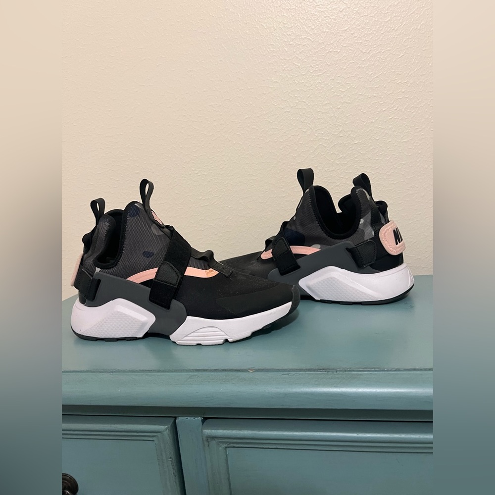 NIKE shoes, Black and Grey army print; with hints of pink lining. Black straps.